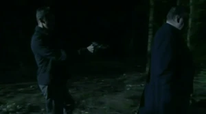 Jack Dalton is frogmarched by Dennis into the woods for his execution.