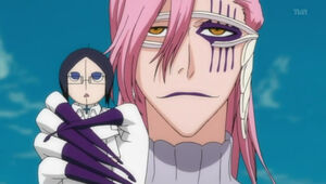 Szayelaporro with a doll of Uryu.