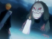 Grand Fisher Stops Ichigo Kurosaki with image of Masaki Kurosaki