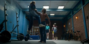 Billy chokes Eleven in front of her friends.