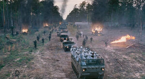 Giant Spider Creatures (the creatures that are being incinerated by the Military army).