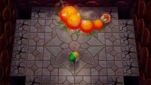 Link battling Moldorm in the Tail Cave.