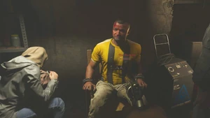 The Butcher with his family, as Price and Garrick interrogate him.