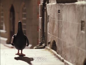 Feathers approaching the museum with a booklet in his hand.