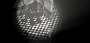 Shadow Freddy sitting in the withered Bonnie's place.(FNAF 2)