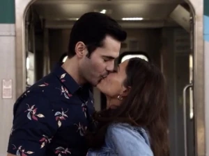 Couple sharing a kiss at the supposed success.