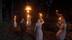 The Klan burning a cross.
