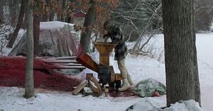 Carl's dismembered corpse is fed into a wood chipper by Gaear.