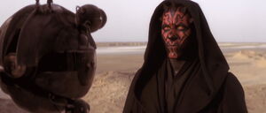 Maul silently conversing with one of his probe droids