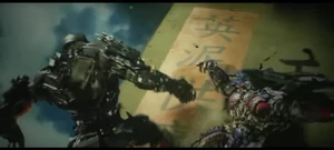 Lockdown knocking Optimus Prime down the wall.