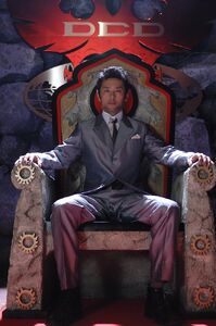 Nobuhiko Tsukikage seated on the throne of Dai-Shocker.