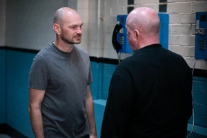 Phil Mitchell getting hassled by his prison cellmate Craig Erskine.