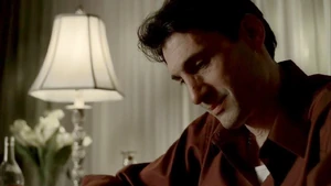 GenePfamilysad.jpg (54 KB) Gene Pontecorvo looking at old family photos.