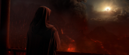 Vader outside overlooking the turbulent volcanic terrain.