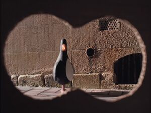 Feathers spotting Gromit hidden, spying on the former.