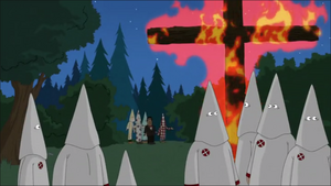 The Ku Klux Klan at a cross-burning gathering.