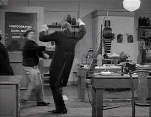 Grover pushed away by Ravelli