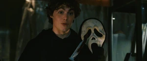 Ethan shows Nancy Loomis' mask to Sam.