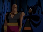 Ubu and Batman frowning at each other