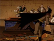 Ubu noticing Batman and Talia escape