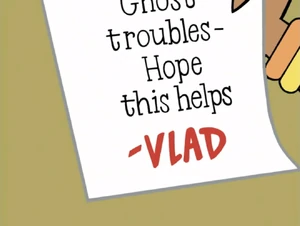 Valerie Gray reading a note from Vlad from a box that contains her ghost hunting equipment.