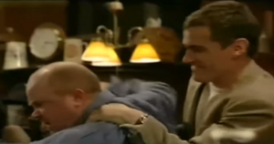 Phil gets restrained by Nathan for causing a scene in The Queen Vic (2002).