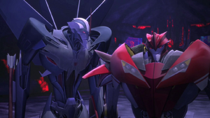 Starscream looks at Knock Out