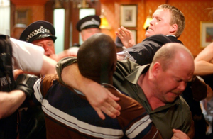Phil attempting to stop a brawl at The Queen Vic in 2002.