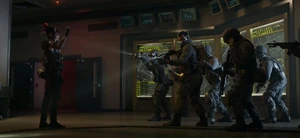 Kitsune confronted by Woods and his team as they are brainwashed.