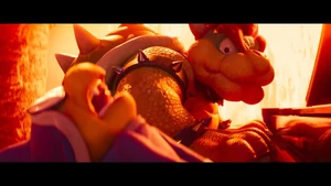 Bowser slamming Kamek's hands inside his piano case.