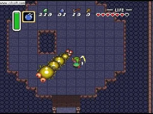 Link battling Moldorm in the Tower of Hera.