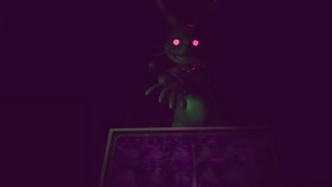 Glitchtrap attempts to merge with Vanessa.