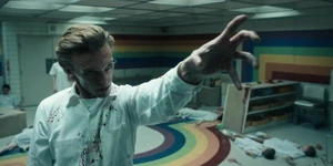 A flashback of a bloodied One telekinetically restraining Two after killing most of the test subjects.