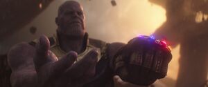 Thanos singling Strange to hand over the Time Stone.