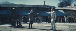 Catching Fire Haymitch protects Katniss from peacekeeper