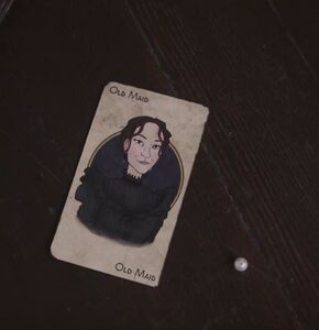 the Old Maid's new card, with its apparently trapped victim.