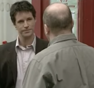 Phil Mitchell clashing with Sharon's boyfriend Tom Banks.