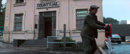 Francis pouring gasoline around the police station.