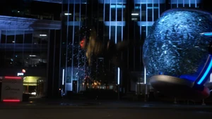 Reverse-Flash being hit by an incoming Time Sphere.