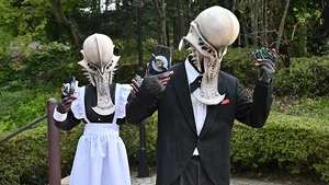 A Butler and Maid Jyamato about to equip Desire Drivers.