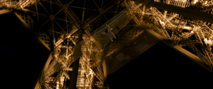 Kenji plummeting to his death from the Eiffel Tower.