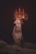 Varré engaging the Tarnished in battle.
