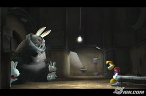 An early screenshot of Sergueï and a company of Rabbids humiliating Rayman in his cell in the prototype version of Rayman Raving Rabbids.