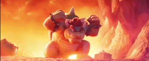 Bowser preparing to jump towards Mario.