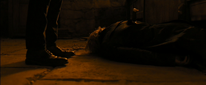Silva lies dead at Bond's feet. (Bond: Last rat standing!)