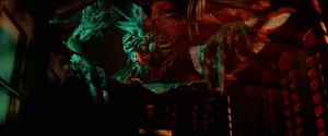Birkin, now fully mutated into G, attacks the survivors.