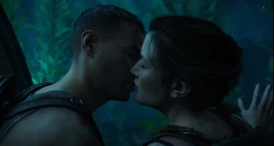 Owen and Abby kiss in the Seattle aquarium.