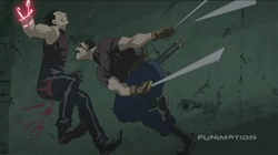 Bradley slices off Greed's arm and leg.