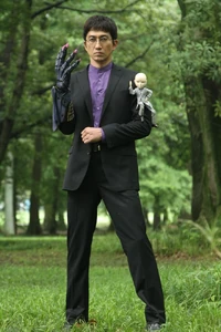 Kyouryu Greeed 2.jpg (147 KB) Dr. Maki partially becomes the Kyoryu Greeed.