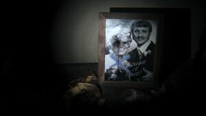 P T Gouge Photo.jpg (73 KB) Lisa (with her eye missing) in a photo with her husband with the words "Gauge it out!" written at the bottom.